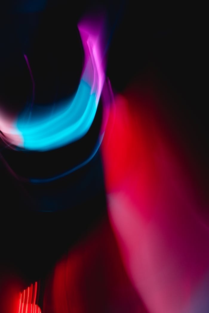 about-01 Vibrant abstract image of colorful light streaks creating a dynamic, futuristic effect.